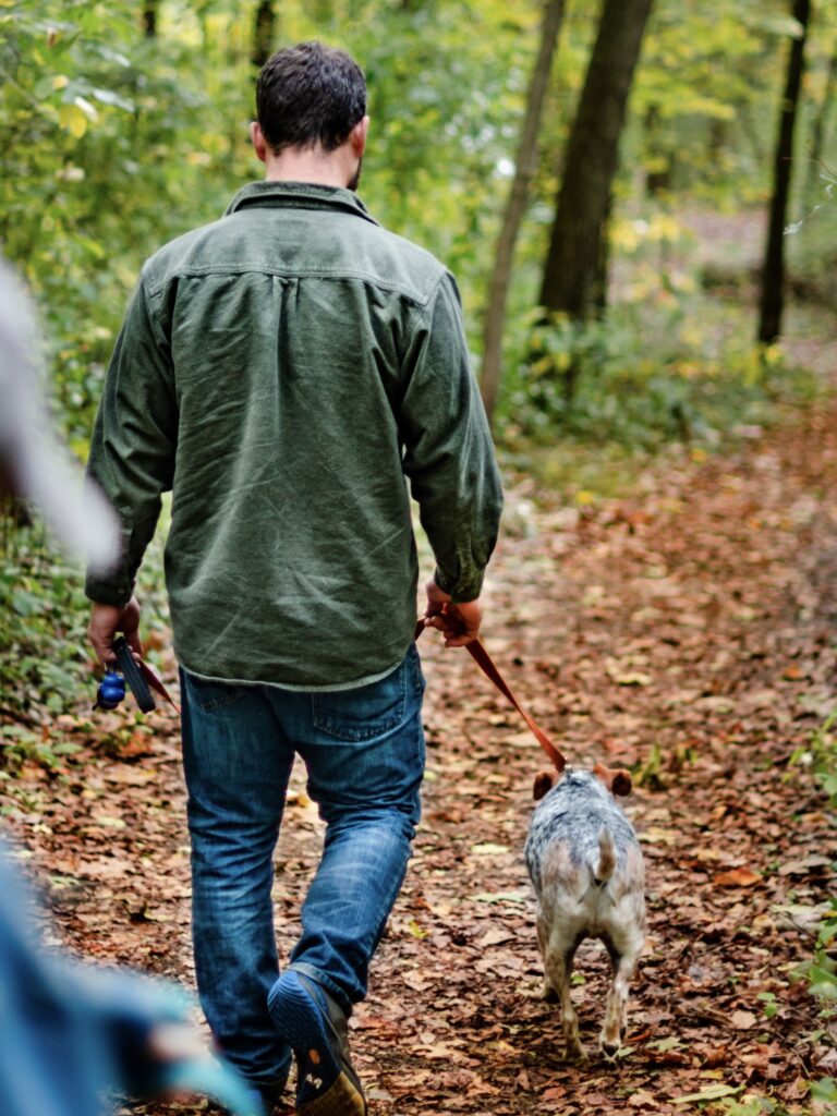 Man walking a dog on a leash