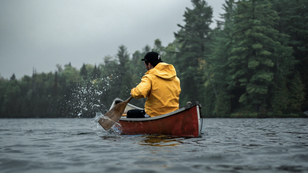 Man paddling a canoe