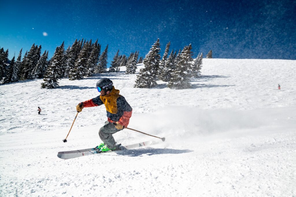 Person downhill skiing