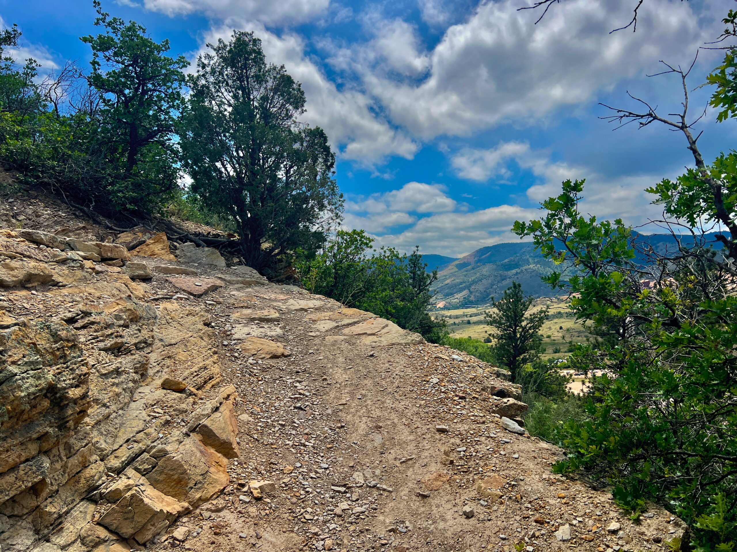 Trail leading toward Denver Basin Overlook with a valley visible below
